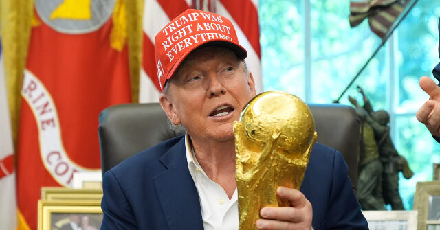 Donald-Trump-holds-World-Cup-trophy-640x335.jpg