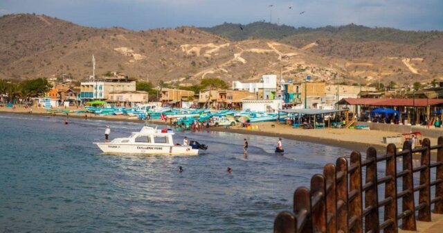 1_Dive-boat-and-beach-scene-on-the-Ecuador-coast-Puerto-Lopez-Manabi-Ecuador.jpg